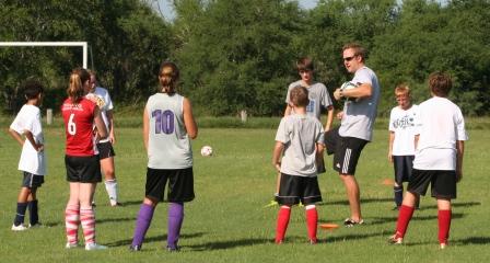 UHV Jaguars coach Adrian Rigby instructs students at the 2010 UHV Soccer Camp.
